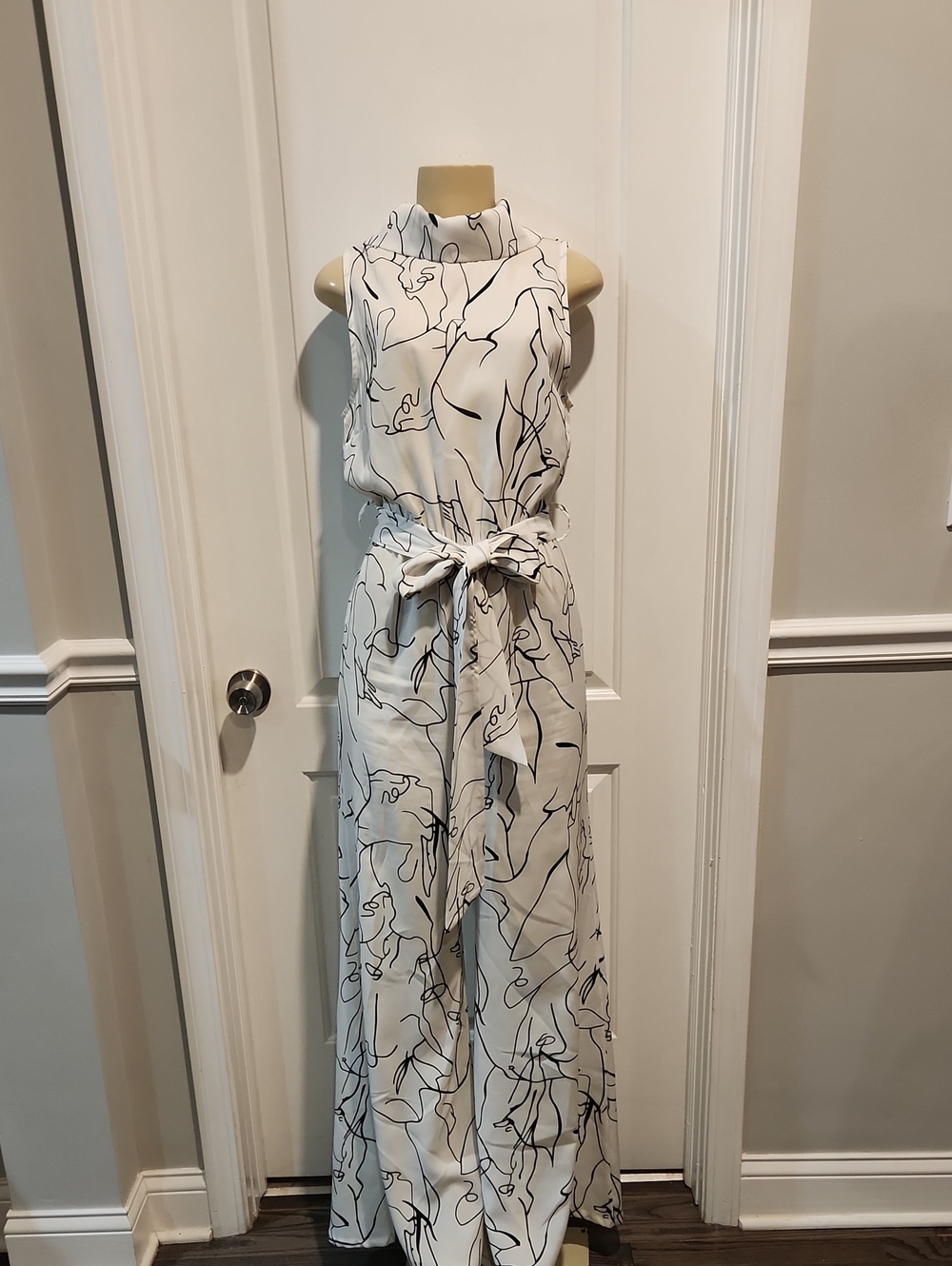 AKIRA White Sleeveless Jumpsuit with Black Abstract Line Print and Tie Waist
